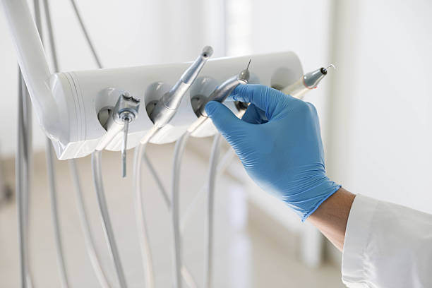 Professional Tooth Extraction technician working in Romeoville, IL